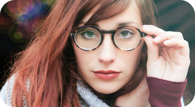 Red hair brunette wearing round spectacles